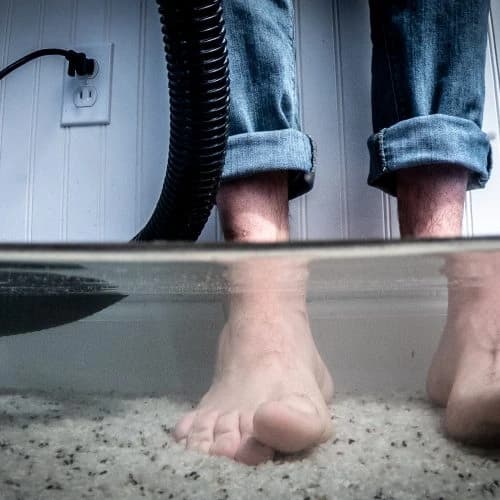 Flooded basement demonstrating the need for professional waterproofing